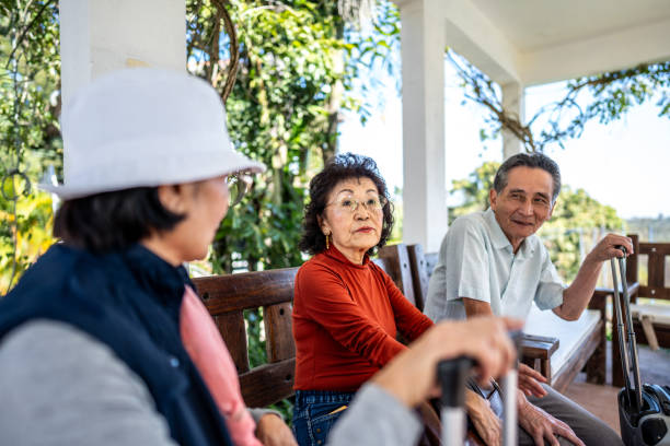 istock Traveler senior friends talking at a hotel 1576458096