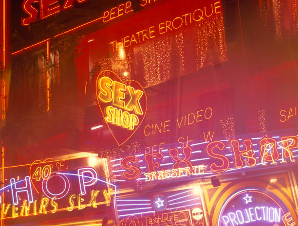 neon lights at red light district von paris, frankreich. - sleaze stock-fotos und bilder