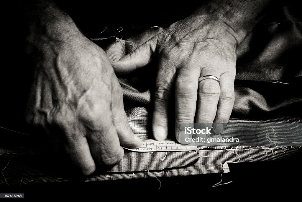 Tailor at work Close up of a older man at work as a tailor. Tailor Stock Photo