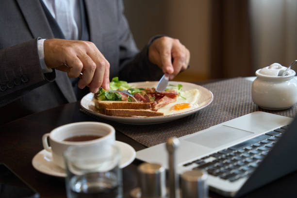 istock Traveler is chatting online during breakfast 1576460829