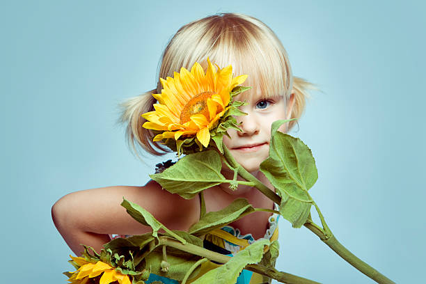 istock Little girl and Flowers 157646184