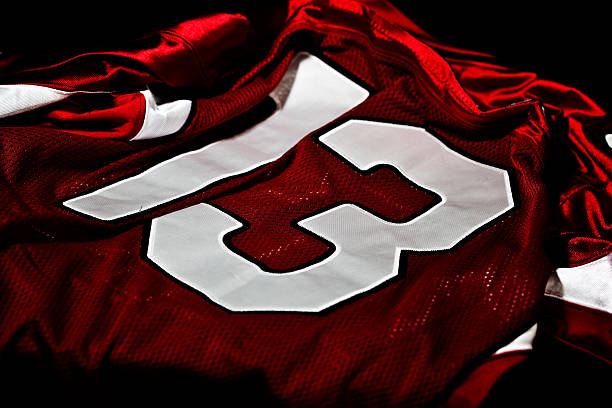 Dark red and white jersey with the number thirteen on it [b][font=aerial][size=10][color=Black][align=left][url=http://www.istockphoto.com/file_search.php?action=file&lightboxID=13196439]Click Here for My American Football Images Lightbox[/url] [/align][/color][/size][/font][/b][align=left][url=/file_closeup.php?id=22885715][img]file_thumbview_approve.php?size=1&id=22885715[/img][/url] [url=/file_closeup.php?id=21642831][img]file_thumbview_approve.php?size=1&id=21642831[/img][/url] [url=/file_closeup.php?id=21513902][img]file_thumbview_approve.php?size=1&id=21513902[/img][/url] [url=/file_closeup.php?id=21745127][img]file_thumbview_approve.php?size=1&id=21745127[/img][/url] [url=/file_closeup.php?id=21513929][img]file_thumbview_approve.php?size=1&id=21513929[/img][/url] [url=/file_closeup.php?id=21513952][img]file_thumbview_approve.php?size=1&id=21513952[/img][/url] [url=/file_closeup.php?id=21513995][img]file_thumbview_approve.php?size=1&id=21513995[/img][/url] [url=/file_closeup.php?id=21513854][img]file_thumbview_approve.php?size=1&id=21513854[/img][/url] [url=/file_closeup.php?id=21513966][img]file_thumbview_approve.php?size=1&id=21513966[/img][/url] [url=/file_closeup.php?id=22885705][img]file_thumbview_approve.php?size=1&id=22885705[/img][/url] [url=/file_closeup.php?id=19457777][img]file_thumbview_approve.php?size=1&id=19457777[/img][/url] [url=/file_closeup.php?id=14296906][img]file_thumbview_approve.php?size=1&id=14296906[/img][/url] [url=/file_closeup.php?id=19583537][img]file_thumbview_approve.php?size=1&id=19583537[/img][/url] [url=/file_closeup.php?id=14232595][img]file_thumbview_approve.php?size=1&id=14232595[/img][/url] [url=/file_closeup.php?id=14232582][img]file_thumbview_approve.php?size=1&id=14232582[/img][/url] [/align]

[b]Other Sports Fields[/b]
[url=/file_closeup.php?id=7488313][img]file_thumbview_approve.php?size=1&id=7488313[/img][/url] [url=/file_closeup.php?id=13092698][img]file_thumbview_approve.php?size=1&id=13092698[/img][/url] sports uniform photos stock pictures, royalty-free photos & images