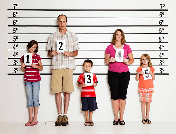Police Line-Up of a Family A police station line-up of a family of five. child arrest stock pictures, royalty-free photos & images