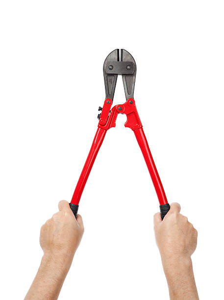 Hands Holding Bolt Cutters  bolt cutter stock pictures, royalty-free photos & images