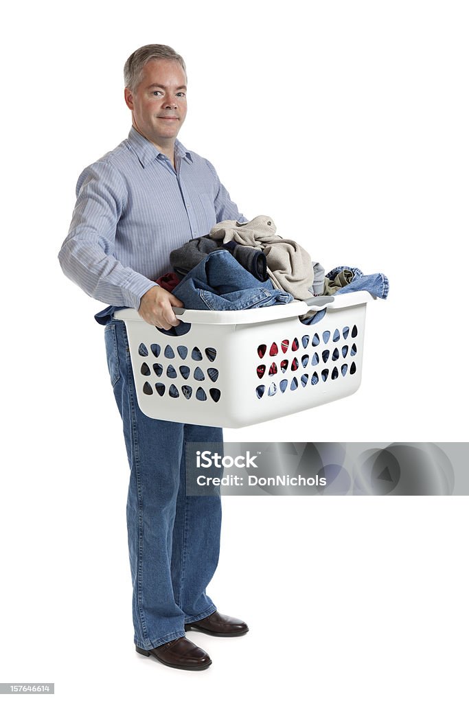 Alegre hombre con lavandería y planchado - Foto de stock de Hombres libre de derechos
