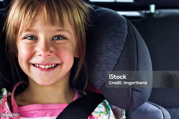 Smiling Girl In Child Car Seat Stock Photo - Download Image Now - People, Blond Hair, Blue