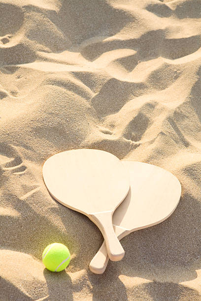istock beach  racquets and ball 157647118