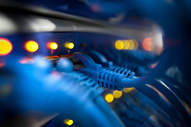 Closeup Of A Server Network Panel with Lights and Cables stock photo