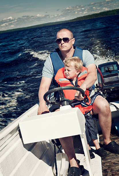 istock Father and Son in Motorboat 157647929