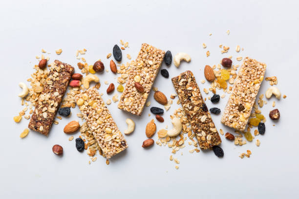 istock Various granola bars on table background. Cereal granola bars. Superfood breakfast bars with oats, nuts and berries, close up. Superfood concept 1576480636