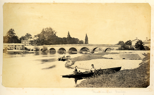 Vintage photograph taken around 1873 showing the Maidenhead Bridge crossing the River Thames. The bridge was finished and opened for traffic in 1777 and is still in use today.