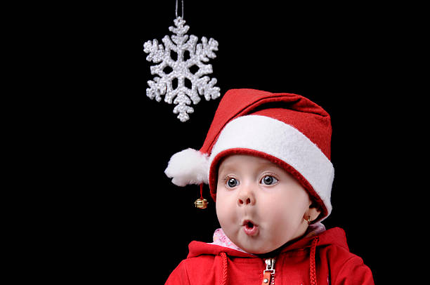 christmas child - christmas child baby surprise photos et images de collection