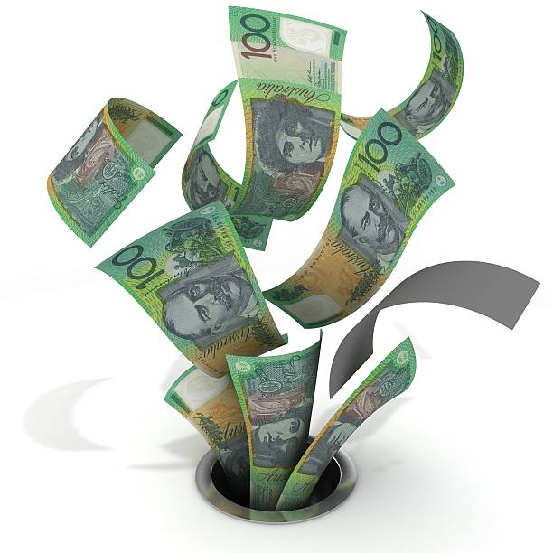 buttare via i soldi-dollaro australiano - money down the drain foto e immagini stock