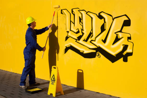 Hand Holding a Spray Paint Can
