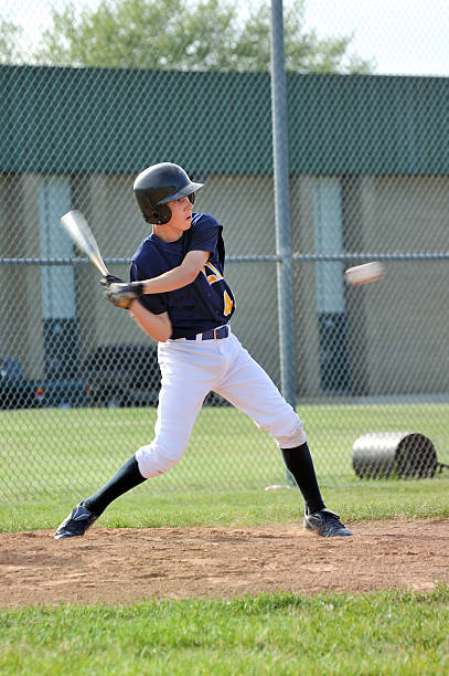Baseball Player Hitting Ball stock photo