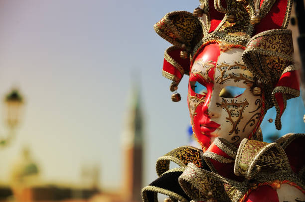Venice, Italy - March 7, 2011: Two unidentified masked persons costume in St. Mark's Square during the Carnival of Venice. The 2011 carnival was held from February 26th to March 8th