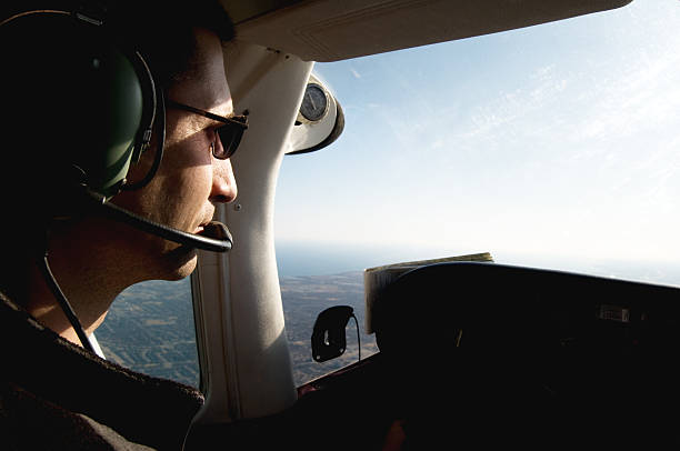 istock Pilot in the cockpit of an airborne small plane 157648919