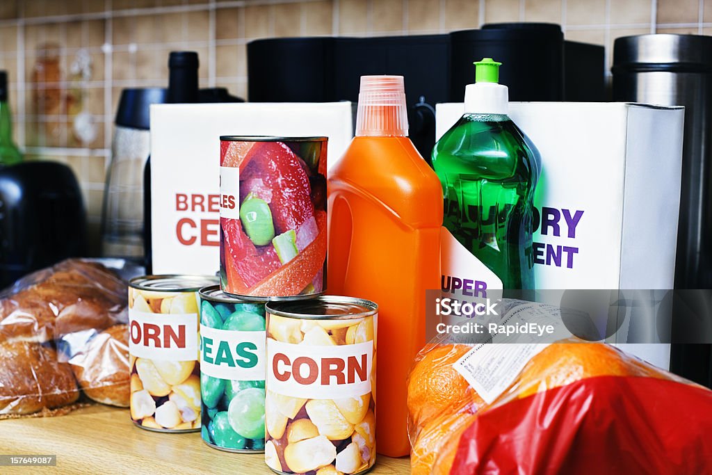 Selection of generic groceries stacked on kitchen counter  Generic - Description Stock Photo