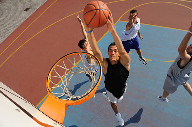 Basketball action  slam dunk stock pictures, royalty-free photos & images