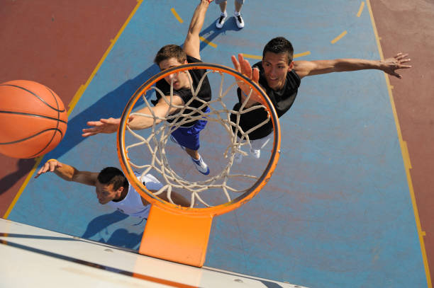 istock Basketball shooting and defending action 157649219