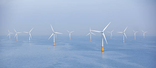 Off-shore park of wind turbines stock photo