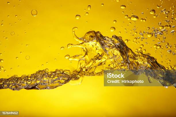 Foto de Amarela Splash e mais fotos de stock de Líquido - Líquido, Óleo de Cozinha, Gasolina