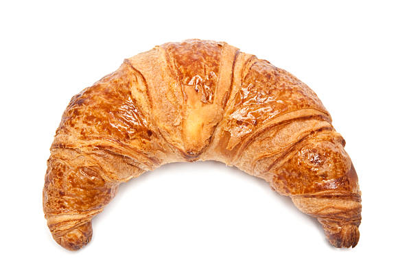 istock A single croissant against a white background 157649689