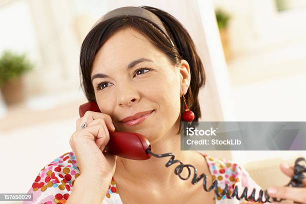 Young Woman On The Phone At Home Stock Photo - Download Image Now - 20-29 Years, 25-29 Years, Adult