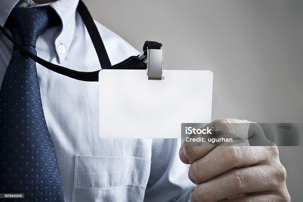 Name Tag Businessman holding blank card. Name Tag Stock Photo