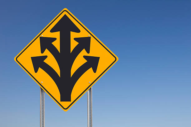 istock Division Ahead or Branching Out Traffic Sign Post Over Sky 157650259
