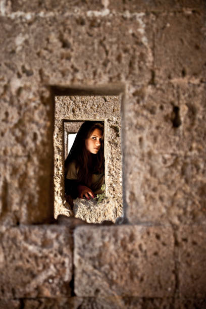 istock Girl Looking At You Through A Wall Hole 157650317