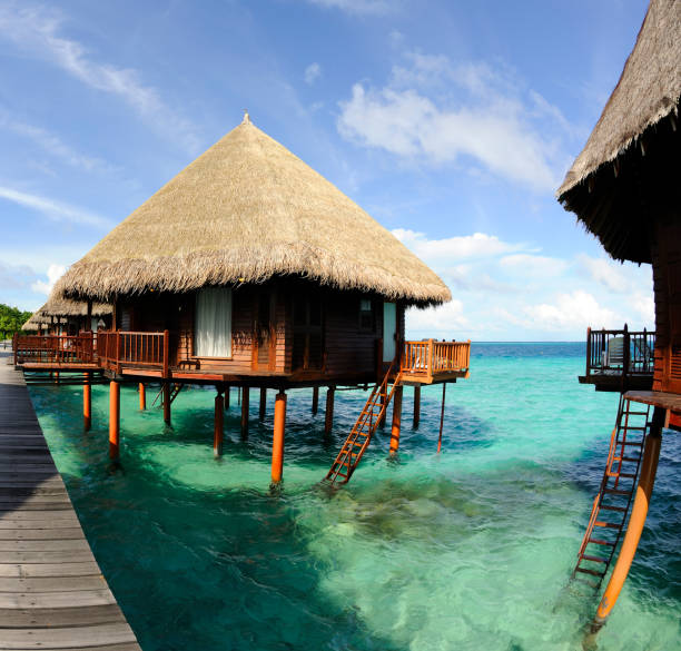 istock Overwater-Bungalow an the beautiful turquoise water 157650326