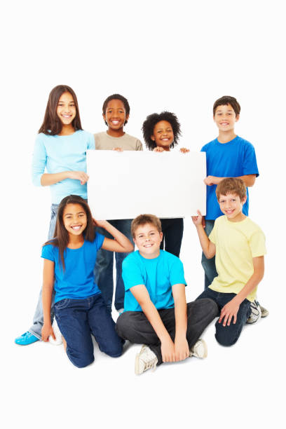 istock Happy children holding placard against white 157650346