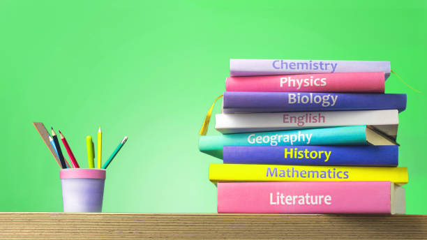 istock School colourfull textbooks on the table. Basic school subjects mathematics, literature, physic,s chemistry and pencils pens in a glass 1576505069