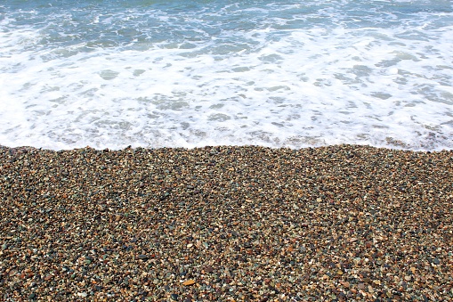 Wave covered Shekvetili beach with pebbles (Georgia)