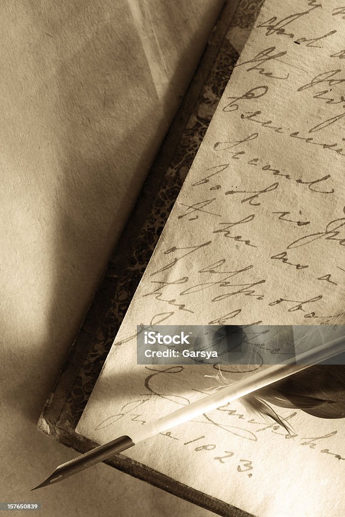 Old book with feather pen Book Stock Photo