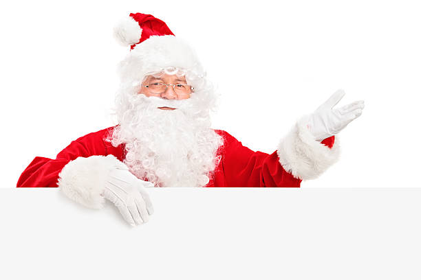 istock Santa Claus posing behind a billboard and gesturing 157653215