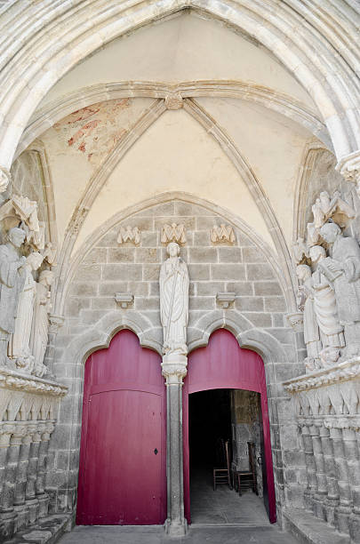 istock Ancient red church door and facade decorated with bas-relief 157653840