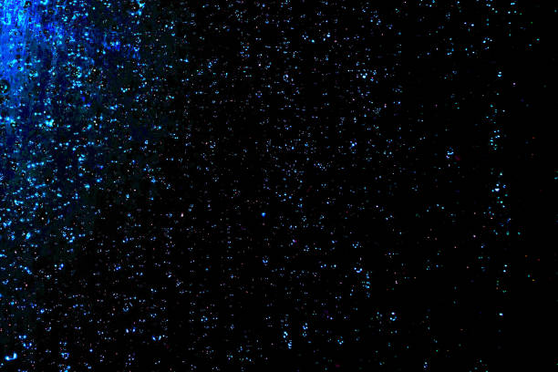 istock Black dark blue white shiny glitter abstract background with space. Twinkling glow stars effect. Like outer space, night sky, universe. Rusty, rough surface, grain. 1576550935
