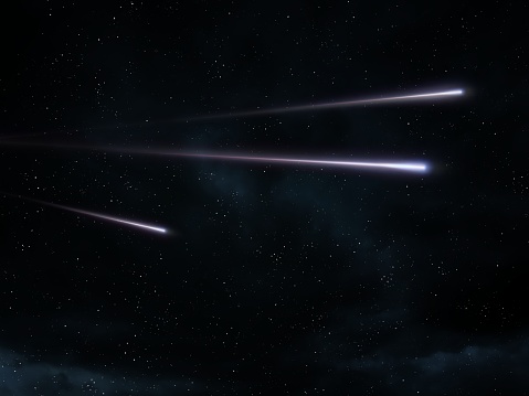Bright streaks of meteors. Three shooting stars in the sky. Meteorites entered the Earth's atmosphere.