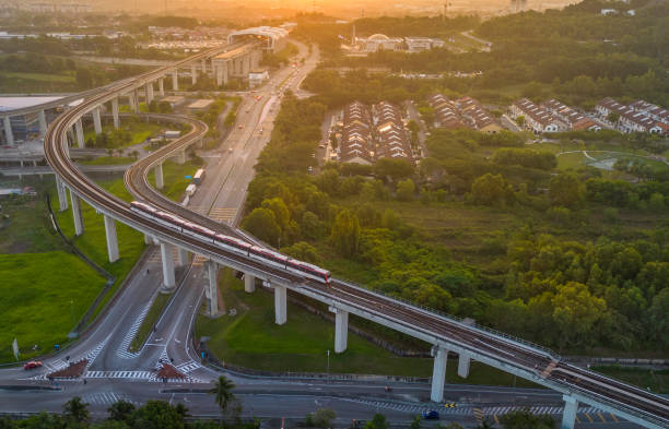 istock drone view of  train to railroad station during sunset 1576560684