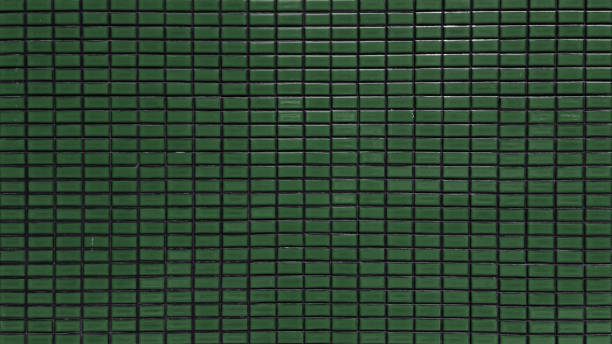 istock close up dark green colored mosaic wall tiles. ceramic tiles in rectangle pattern, emerald colored. vintage green mosaic kitchen wall pattern used as background. 1576562372