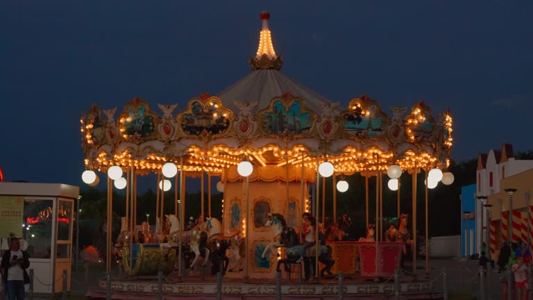 Tsitsinatela carousel with colorful horses amusement park Fun ride with horses