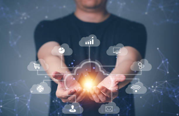 istock Big data analytics and business intelligence concept with charts and graph icons on digital screen interface and business people behind. 1576576652