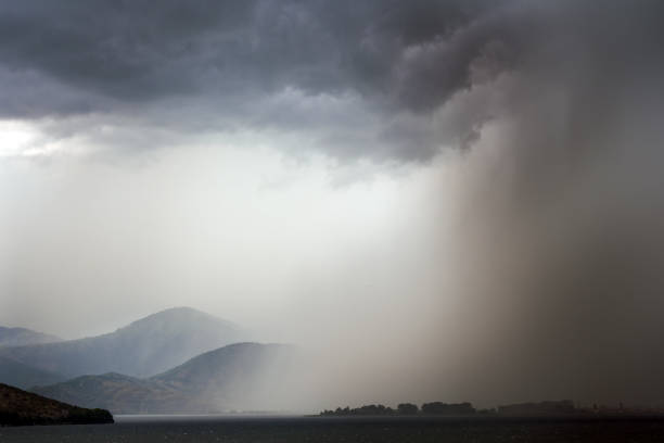 istock summer downpour, rain over the lake 1576577090