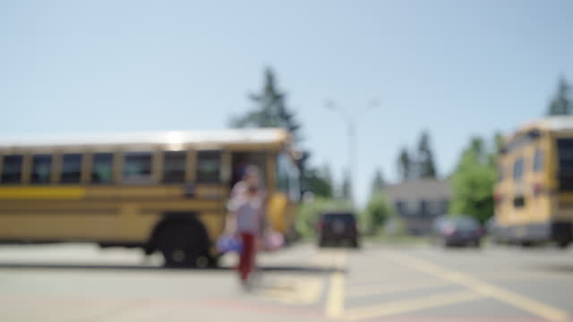 Students arriving at school on school bus