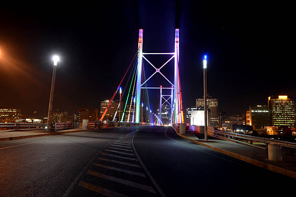 nelson mandela bridge - johannesburg night skyline dusk stock-fotos und bilder