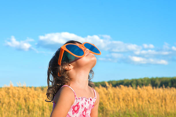 istock Little girl with big sunglasses 157660601