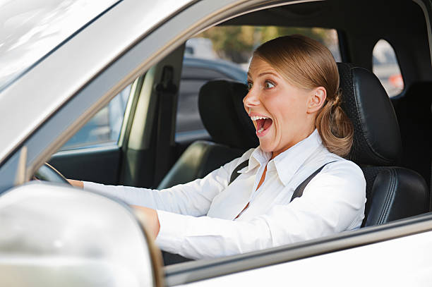istock woman in panic is driving the car 157666182