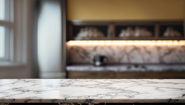istock Empty white marble table and blurred background of modern bedroom interior. for product display 1576684241